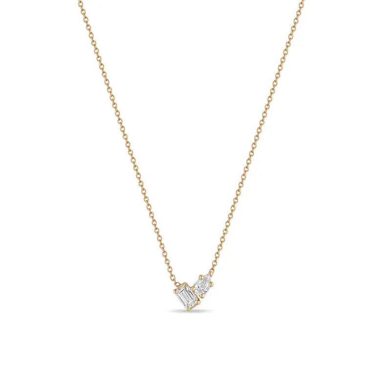 Double Stone Necklace with two clear cubic zirconia stones side by side on a fine gold-plated chain, against white.