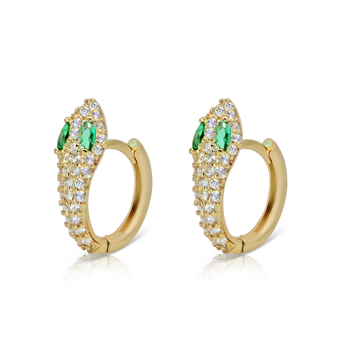 Serpent gold-plated huggie earrings with clear-stone snake heads and green eyes, shown on white.