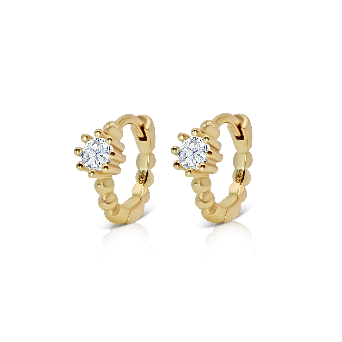 Stacey gold-plated huggie earrings with beaded hoops and a round clear cubic zirconia at the front, shown on white.