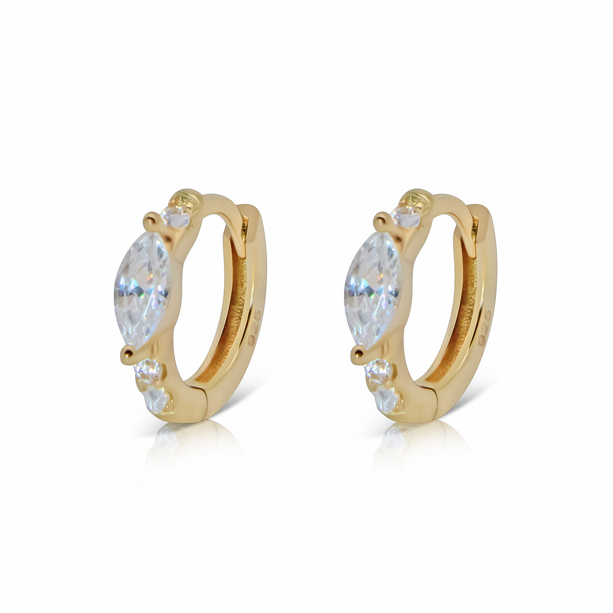 Landon gold-plated huggie earrings with marquise-shaped center stones and small round cubic zirconia above and below.