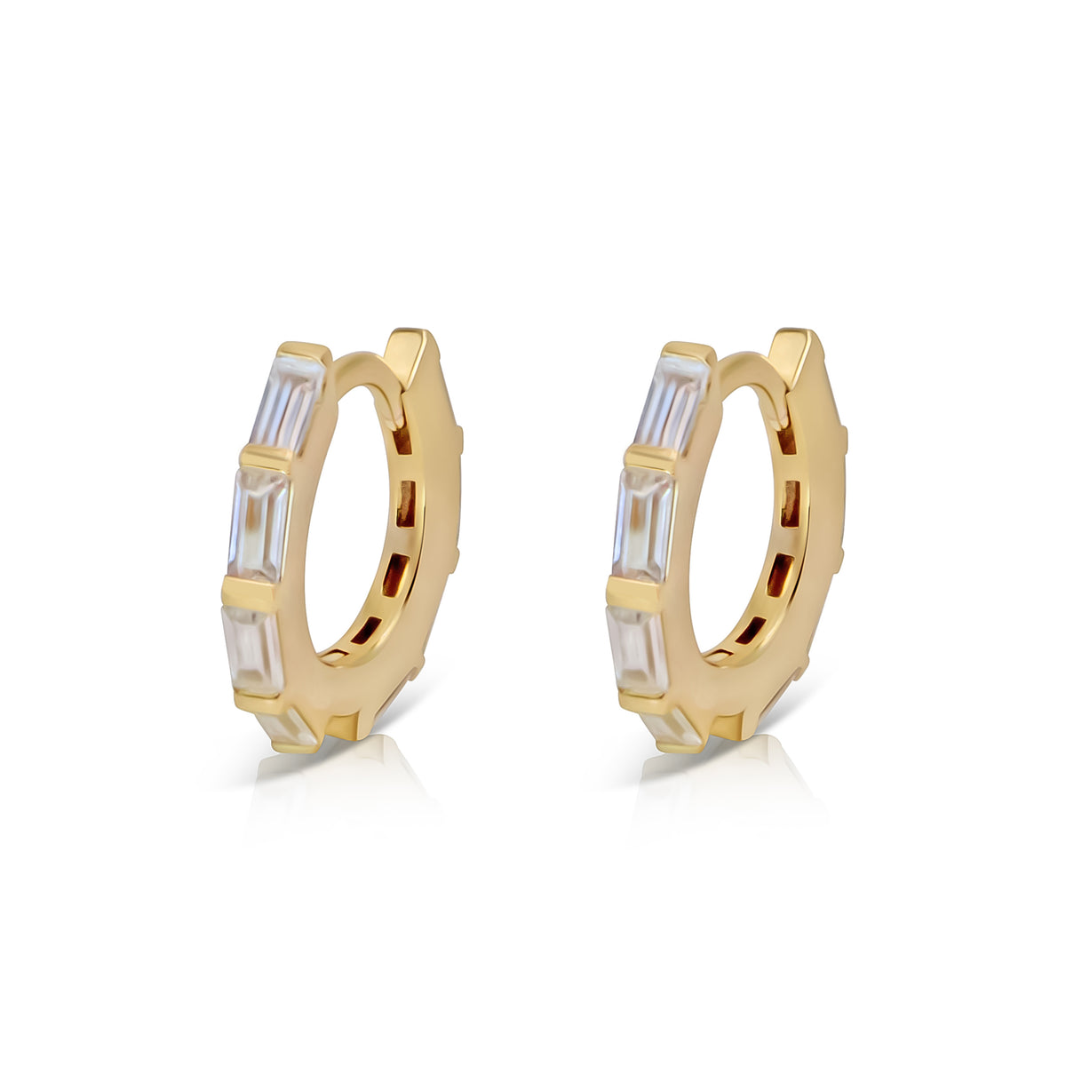 Angie gold-plated huggie earrings with rows of clear baguette-cut cubic zirconia, shown as a pair on white.